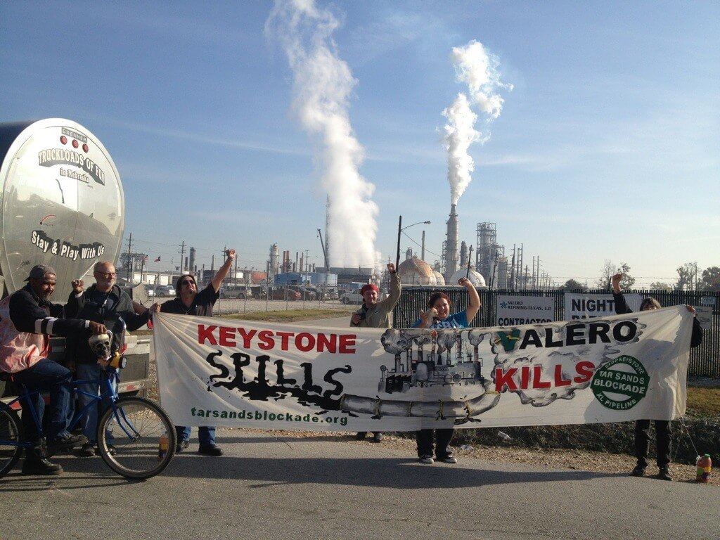HOUSTON, TX – THURSDAY, NOVEMBER 28, 2012 8:00AM –-Longtime Gulf Coast activists Diane Wilson and Bob Lindsey Jr. have locked their necks to oil tanker trucks destined for Valero’s Houston Refinery in solidarity with Tar Sands Blockade’s protests of TransCanada’s Keystone XL pipeline.