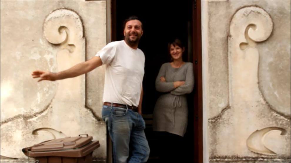 The Mancini's outside their house