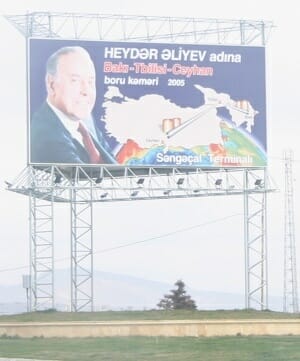 A billboard with the late dictator and the pipeline